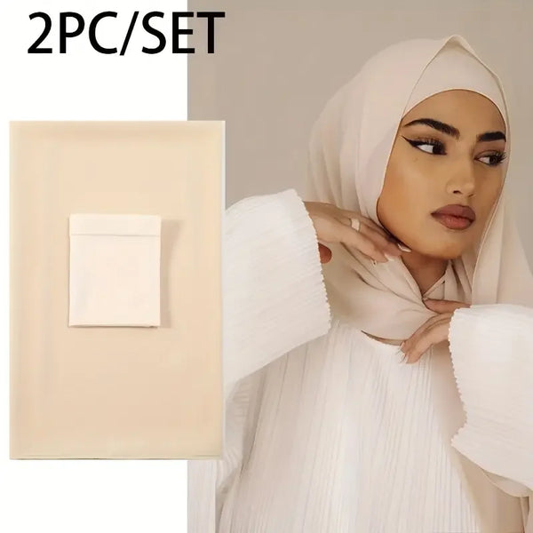 A woman wearing a beige chiffon hijab and a matching two-piece set with a square cosmetic item.