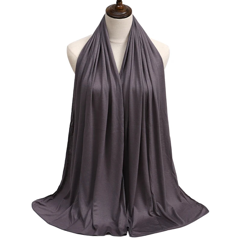 A draped, flowing gray premium modal jersey hijab displayed on a mannequin.