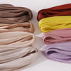 Collection de châles ou hijabs en mousseline crinklée et scintillante dans diverses nuances de rose poudré, or, jaune et lava