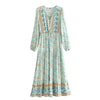A light blue boho floral lantern sleeve maxi dress with intricate embroidery and tiered ruffle hem.