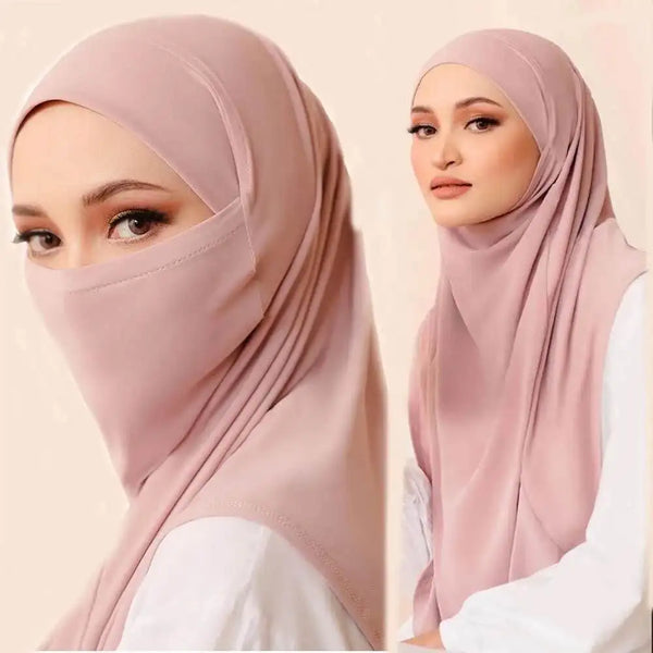 A woman wearing a dusty rose modal jersey hijab scarf with a white top.