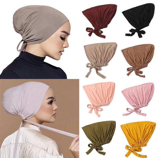 A collection of elegant modal hijab turban caps in various shades including beige, black, brown, and pink.