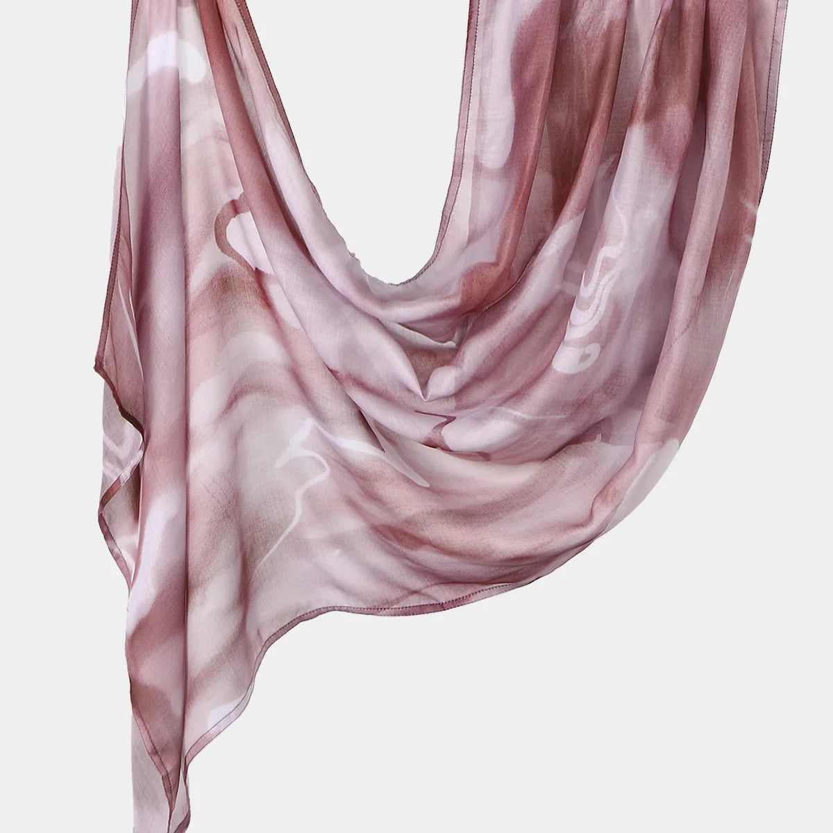 A sheer, flowing mauve printed linen hijab scarf draped elegantly.