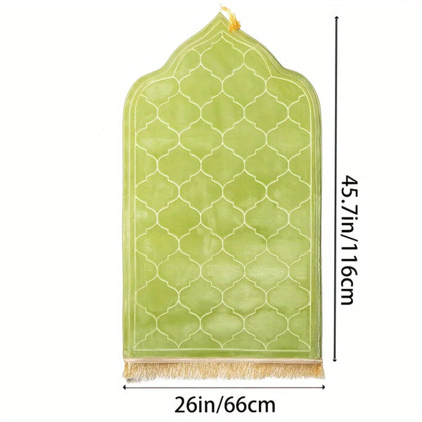 Light green embossed prayer mat with a scalloped edge and tassel