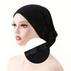 A close-up of a woman's head wearing a black adjustable elastic headband hijab cap.