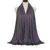 A dark gray soft modal jersey hijab scarf draped around a mannequin's neck.