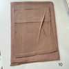 A folded soft mauve hijab set made of modal rayon fabric.