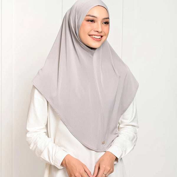 A woman wearing a light gray instant cotton hemp inner hijab turban wrap.