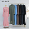 A display of an elegant two-piece Arabic modest set featuring long, flowing dresses in shades of pink, green, and blue.