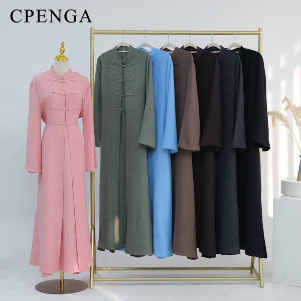 A display of an elegant two-piece Arabic modest set featuring long, flowing dresses in shades of pink, green, and blue.