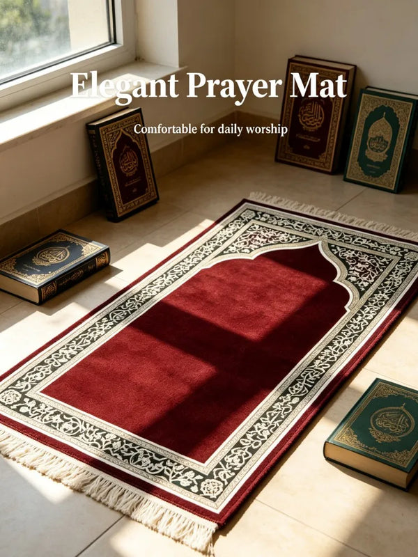 A deep red prayer mat with intricate Arabic calligraphy is displayed indoors on a light floor.