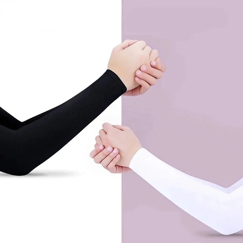 A person wearing a black arm sleeve is holding hands with another person wearing a white arm sleeve.