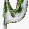 Elegant printed linen hijab scarf featuring a watercolor design of green foliage and plaid patterns.