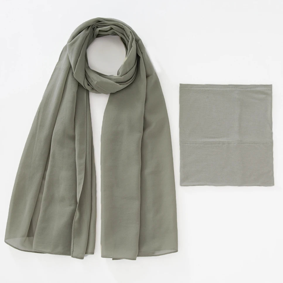 A soft sage green chiffon hijab and underscarf set displayed flat.