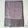 A folded soft lilac gray hijab set made of modal rayon fabric.