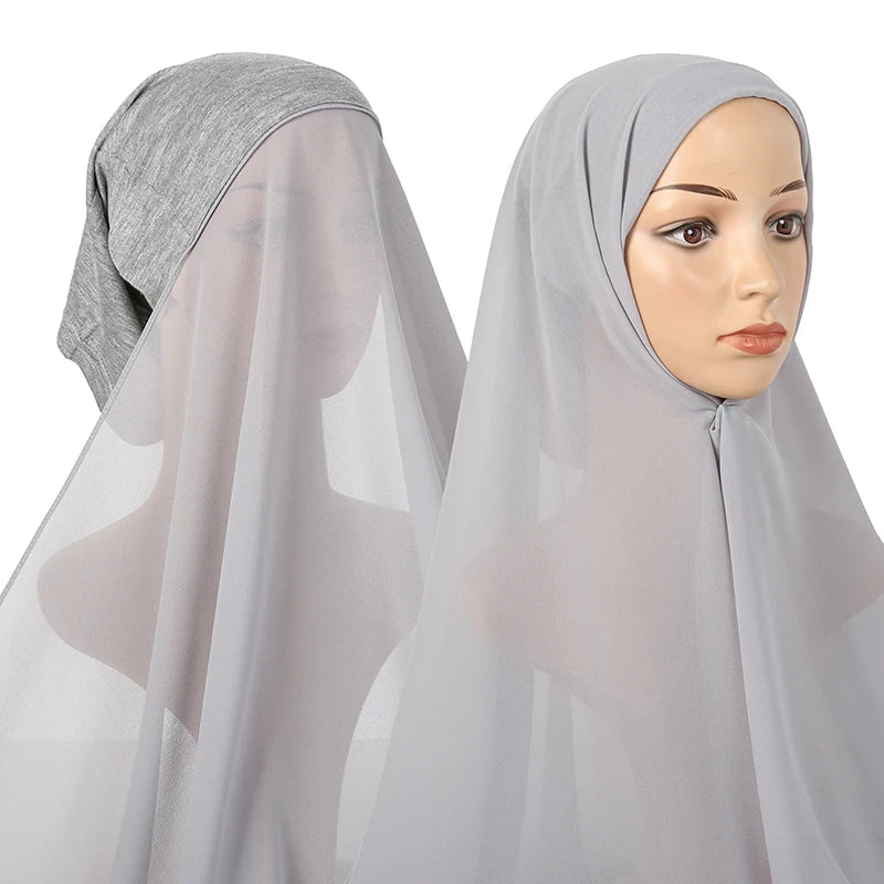 A woman models a sheer gray chiffon instant hijab with a modal cotton cap.