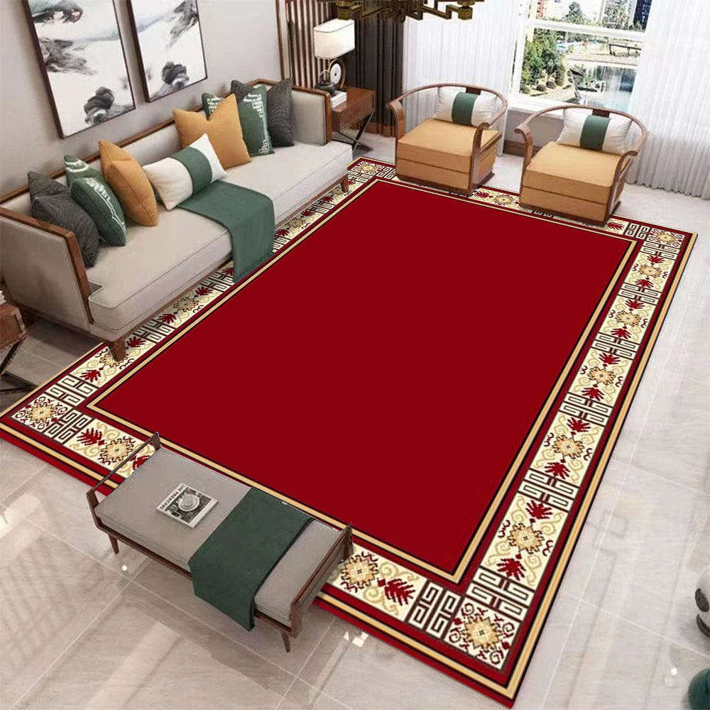Una alfombra de área grande con patrones rojos y crema en un salón.