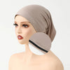 A beige anti-slip inner hijab cap displayed on a mannequin head.