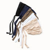 A collection of adjustable elastic headband hijabs in various earth tones including black, navy blue, beige, and white.