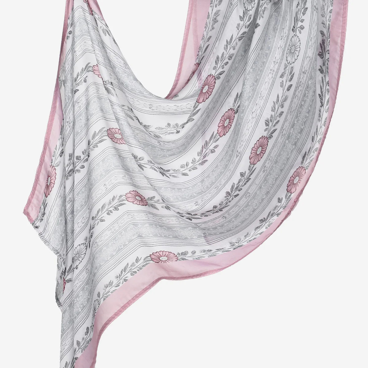 A flowing, light pink and gray printed linen hijab scarf with floral embroidery.