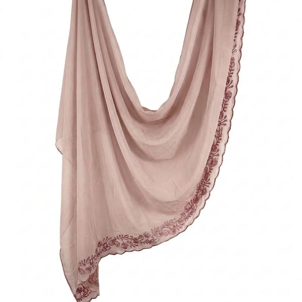 A soft blush pink chiffon hijab scarf featuring an eyelash lace edge.