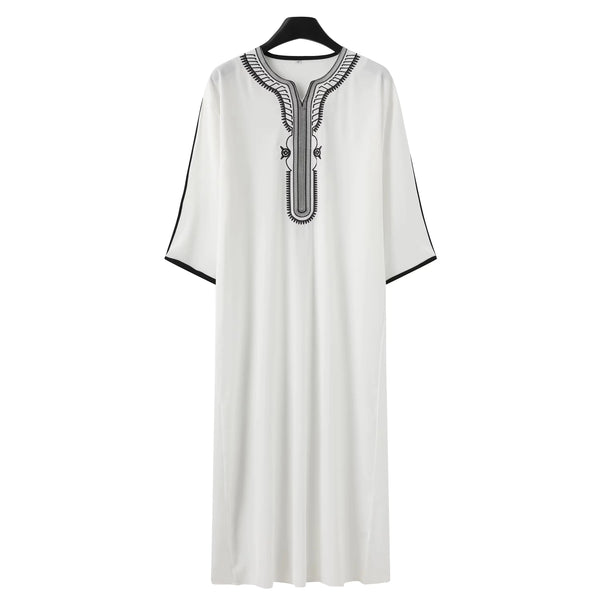 A white, long robe for men featuring elegant embroidery around the neckline.
