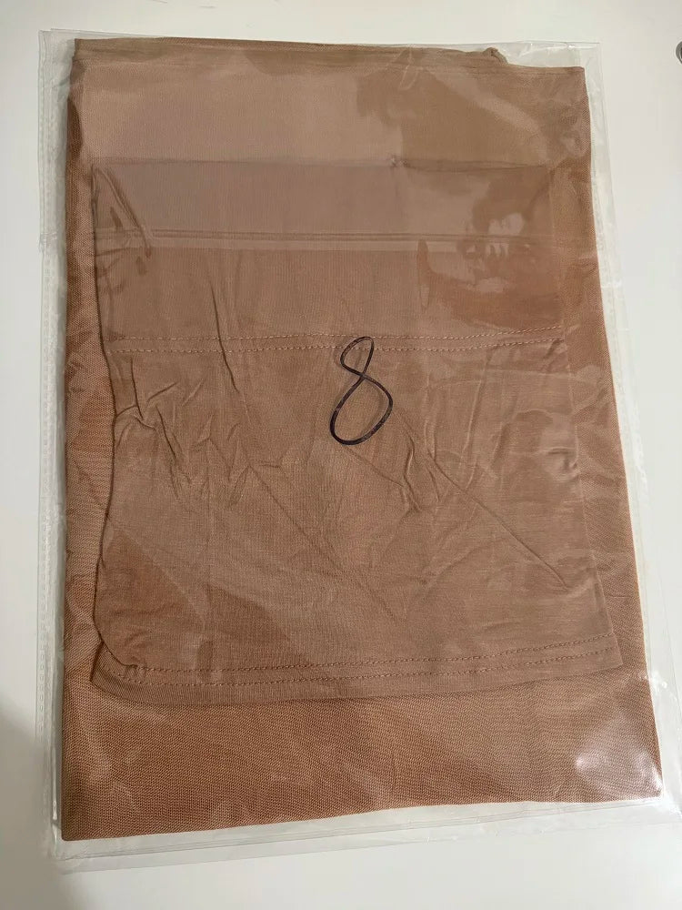 A sheer, light brown soft modal rayon hijab set for women is displayed in clear plastic packaging.