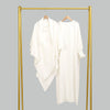 A white elegant two-piece abaya and khimar set displayed on a gold hanger against a gray background.