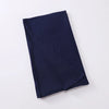 Écharpe instant hijab en jersey extensible bleu marine, pliée et à plat.