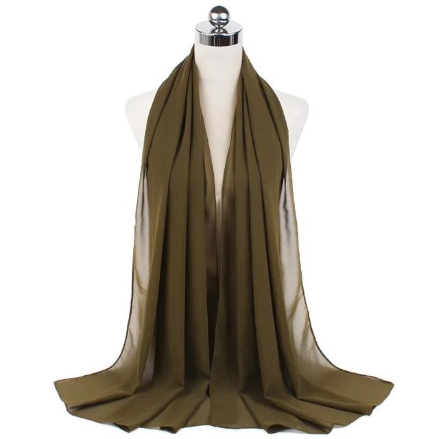 A draped olive green chiffon hijab scarf displayed on a mannequin neck.