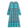 A turquoise bohemian floral maxi dress featuring lantern sleeves and a colorful print.