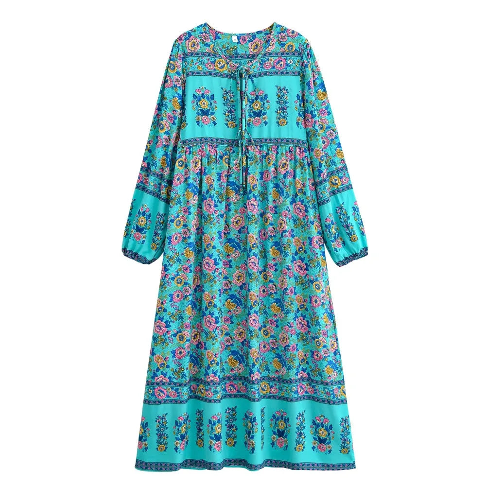 A turquoise bohemian floral maxi dress featuring lantern sleeves and a colorful print.