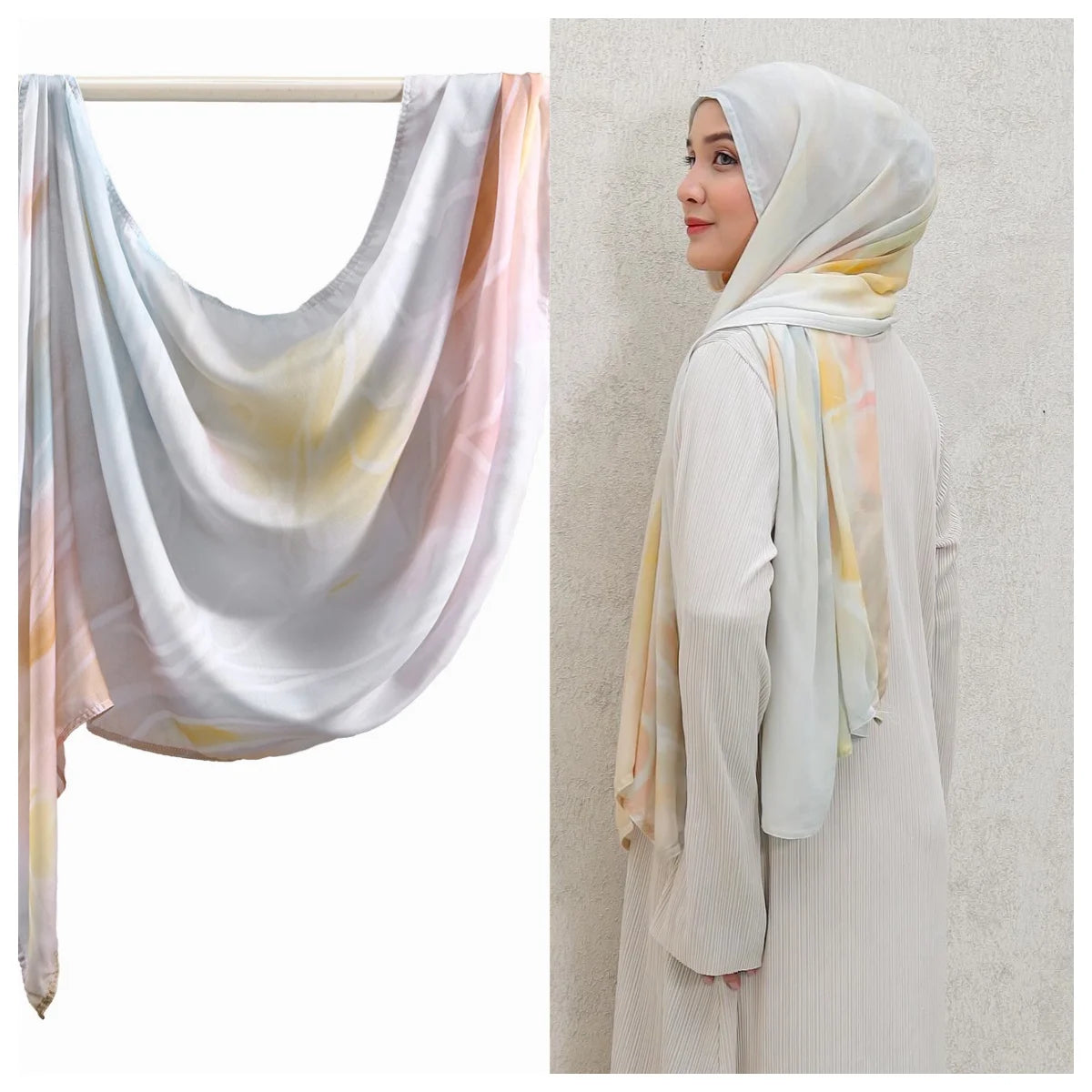 Eine Frau trägt einen hellbeigen Aquarell-Ombré-bedruckten Rayon-Modal-Hijabschal über Kopf und Schultern.