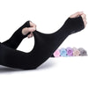 Black cooling UV protection arm sleeve being worn on an arm.