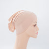Heller pinker Bambus-Jersey-Turban-Cap auf einem Mannequin-Kopf.