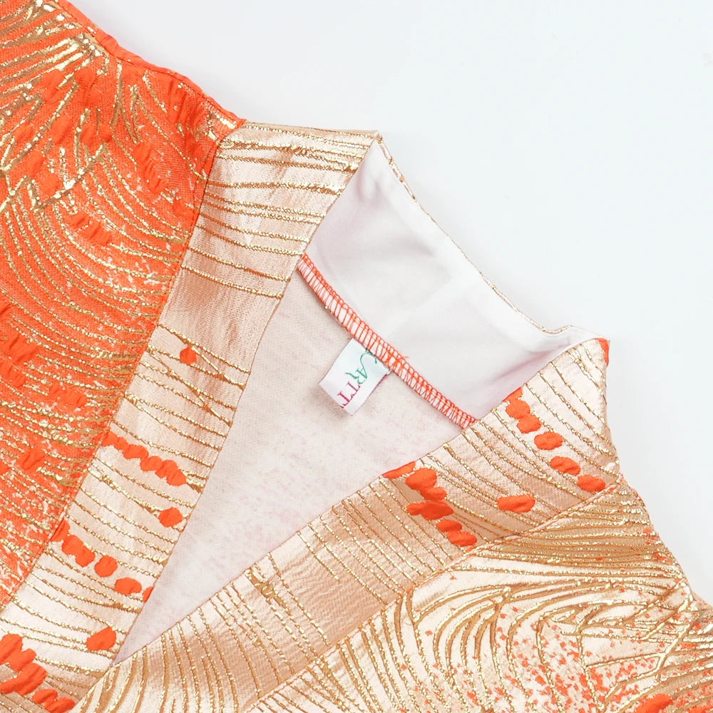 Orange and gold satin kaftan abaya for women shown in a close-up view