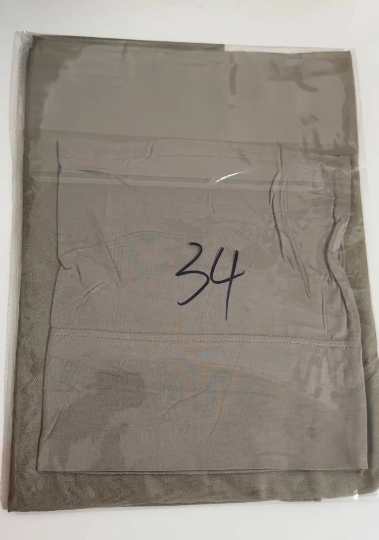A gray soft modal rayon hijab set folded inside a clear plastic bag.