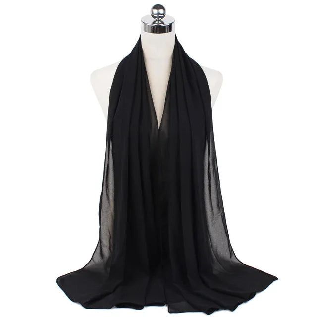 Black chiffon hijab scarf draped around a mannequin neck