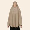 Model wearing a beige full-cover abaya with an inner hijab.
