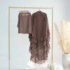 A mauve ruffled two-layer chiffon hijab displayed on a gold hanger against a white background.