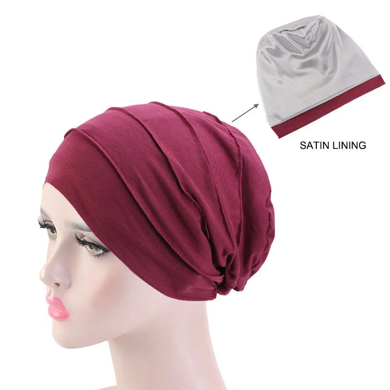 Maroon Stretch Cotton Beanie Turban Hat with Satin Lining Detail on a Mannequin