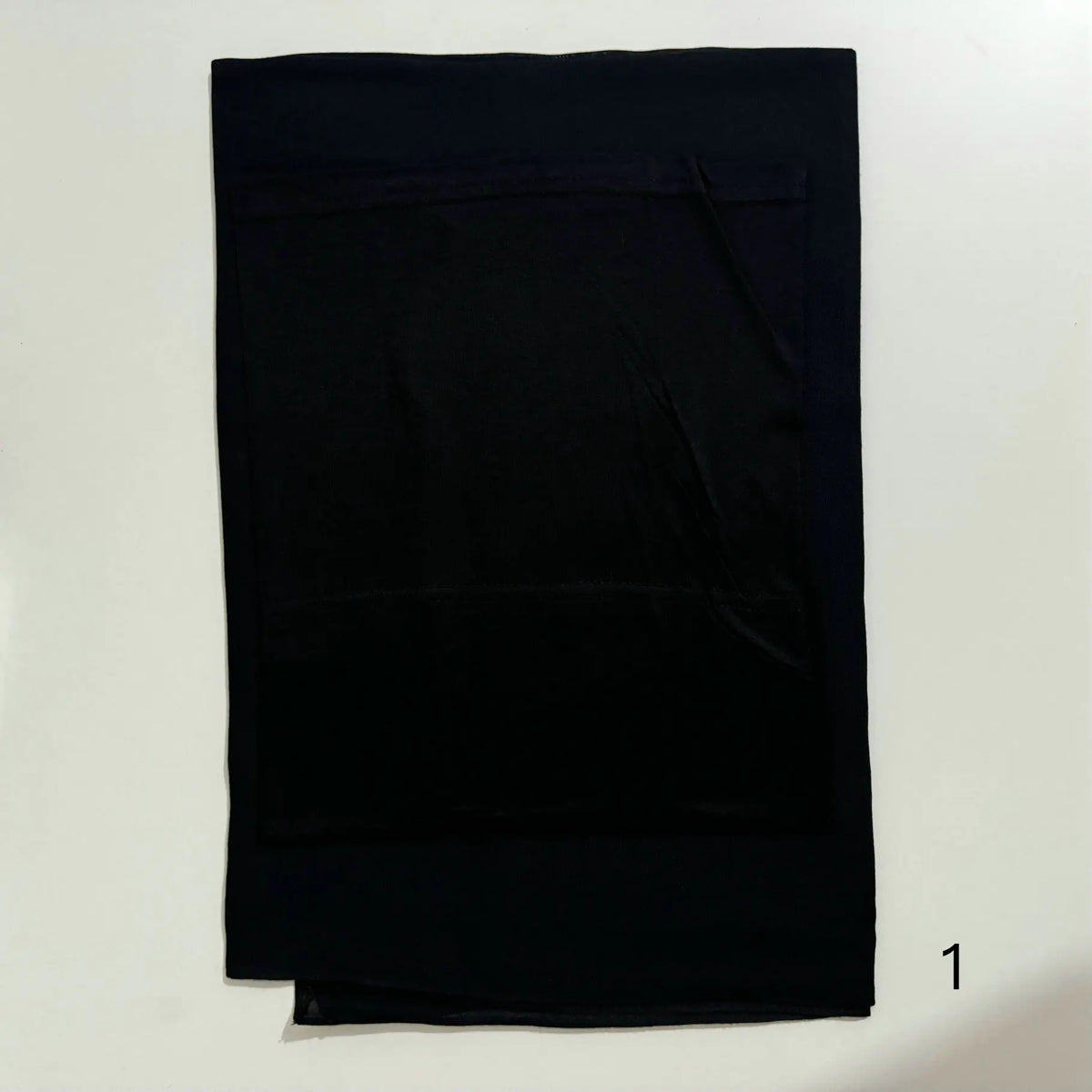 A black soft modal rayon hijab set for women displayed flat.