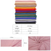Ein Stapel von 20 rosa und erdtonigen Baumwoll-Hijab-Schals, der Textur und Farbvariationen zeigt.