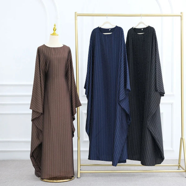 A dark blue striped abaya with bat sleeves displayed on a gold hanger against a white background.