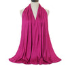 A vibrant magenta soft modal jersey hijab scarf draped around a mannequin's neck.