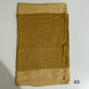 A stack of three solid mustard yellow fabric pieces, likely a hijab set made of soft modal rayon.