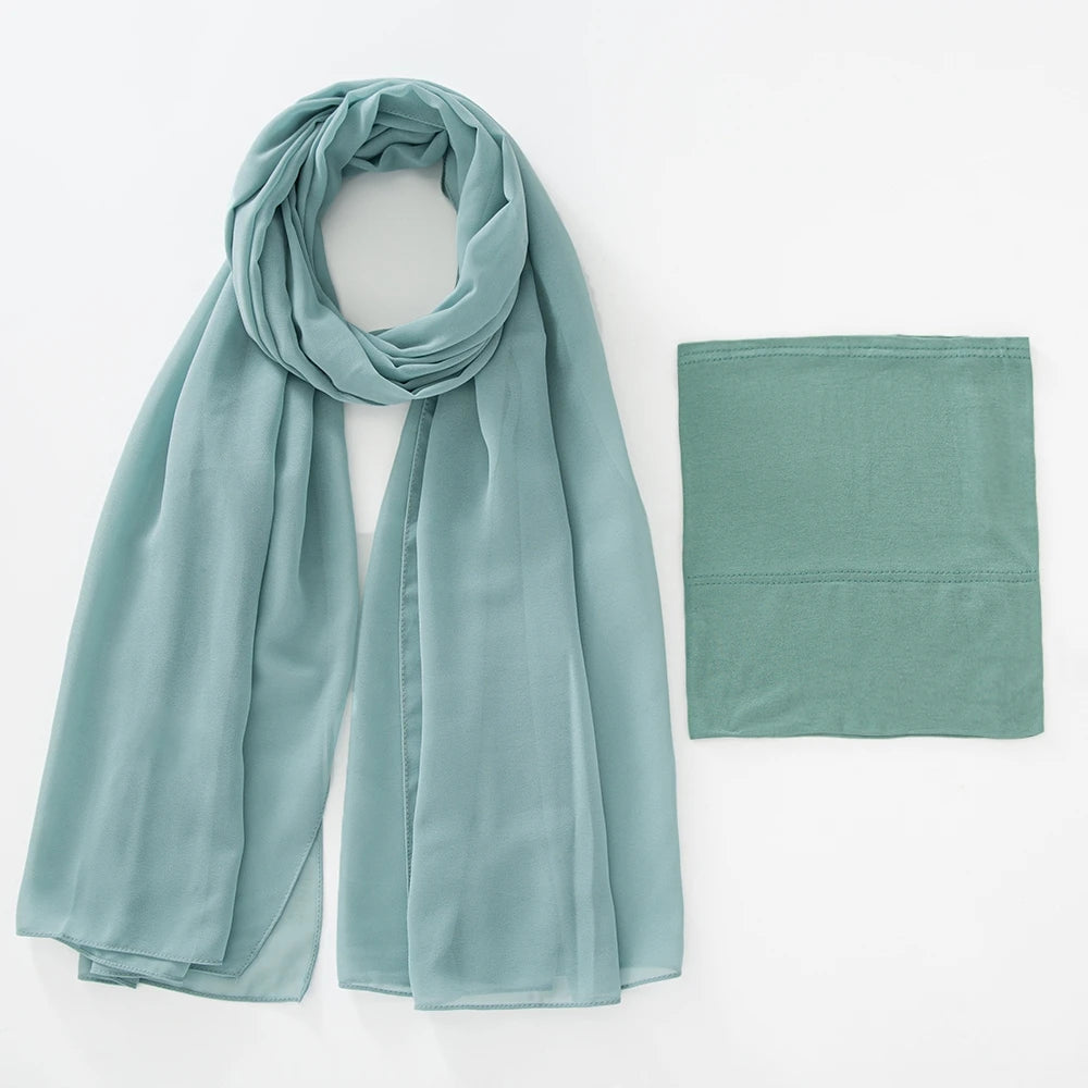 A mint green chiffon hijab and undercap set displayed flat.