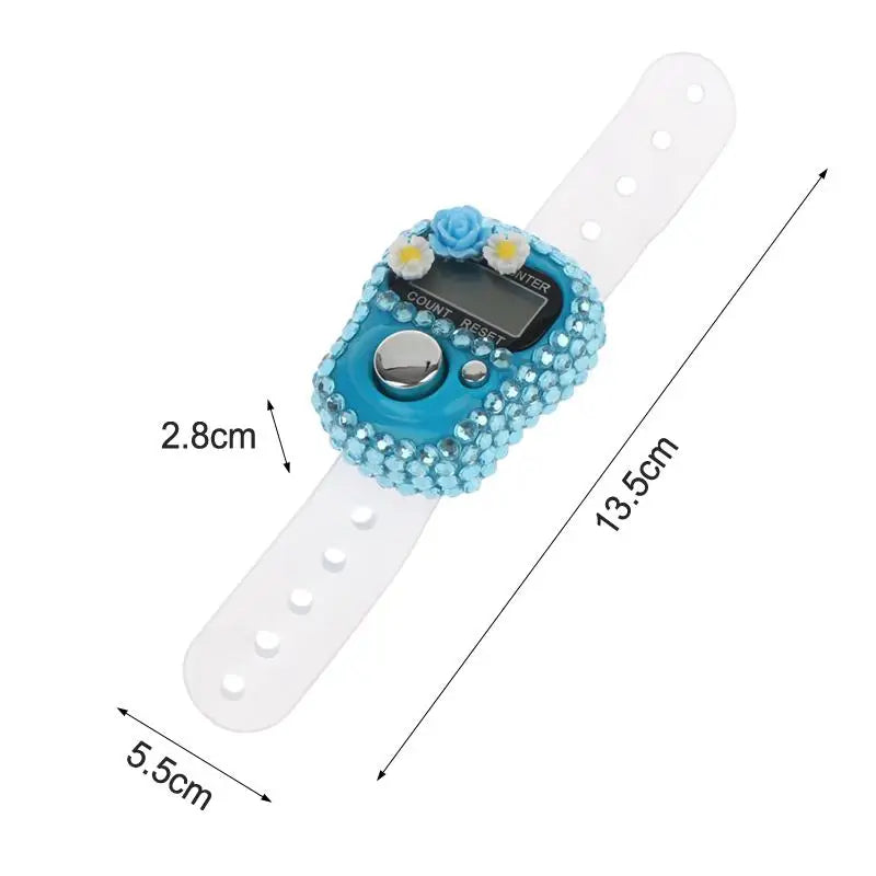 A colorful finger counter device with a blue body and white strap is shown against a white background.
