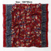 Pañuelo de chifón de algodón rojo vibrante estampado con patrones florales y ribete azul.