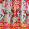 Vestido largo color menta claro con estampado floral vibrante en tonos rosa, naranja y rojo.